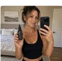 Michelle R. holding a Crowned bottle
